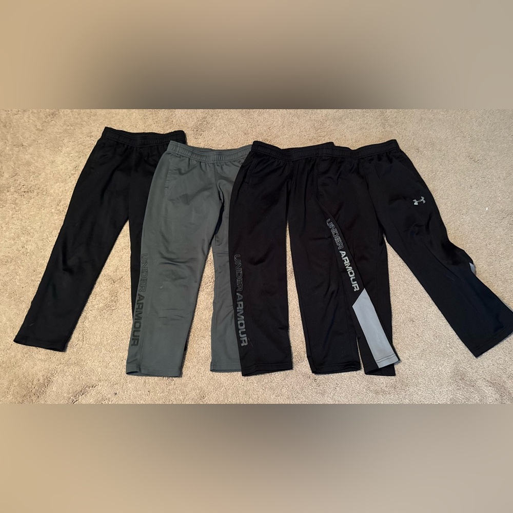 4 pairs of Under Armour Kids' Black and Gray pants